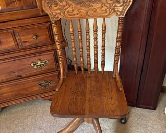 Vintage oak carved rolling desk chair. 