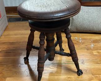 ANTIQUE PIANO STOOL WITH GLASS CLAW FEET