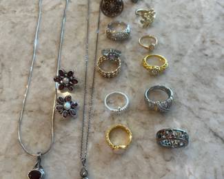 Sterling silver and Garnet necklaces and earrings. Lots of great sterling and gold rings.
