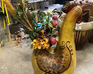 Large terra-cotta booster with floral arrangement