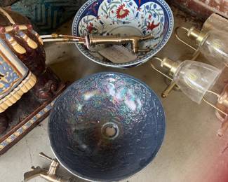 Vessel sinks. The top one is Hand Painted. The other one is beautiful Glass.