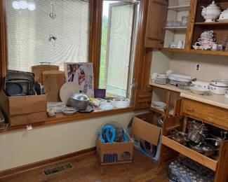 sets of glasses, bakeware, cutting boards, turkey platter, pans