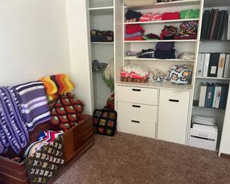 Handmade crocheted quilts and clothing, binders