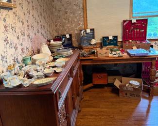 Silverware sets, porcelain pieces, buffet, table and six chairs, wooden boxes