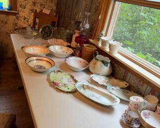 porcelain celery dishes, bowls, trinket dishes, plates, platters, teacups and saucers, oil lamps