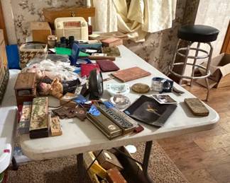 various vintage finds cigar boxes, harmonicas, radio, Stanley tool