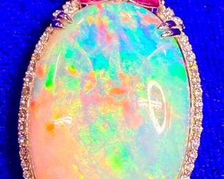 35 carat opal with pink sapphires, diamonds and platinum