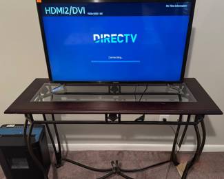 Glass/wood and metal table and television