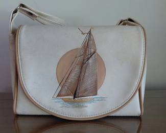 Leather handbag with sailboat design