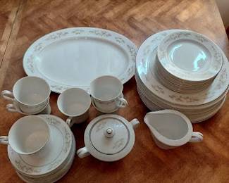 Porcelain dinnerware set with platter, cups, sugar and creamer