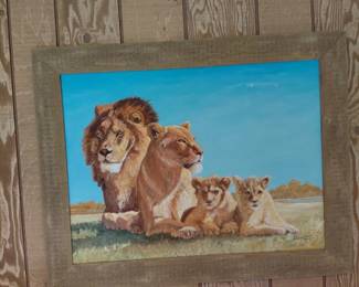 Framed painting of lion family