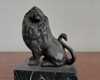 Bronze finish lion figure on marble base