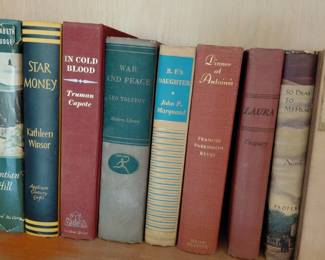 Shelf of vintage hardcover books
