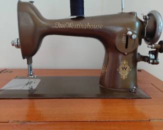 Free-Westinghouse sewing machine in wood cabinet