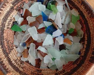 Sea glass collection in woven basket