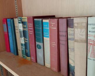 Shelf of vintage hardcover books