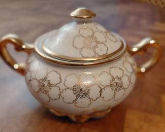 Covered sugar bowl with gold floral pattern