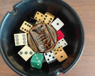 Ashtray with vintage dice and game pieces