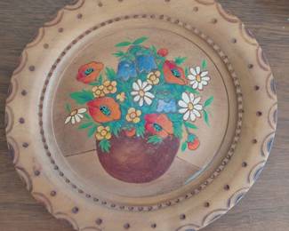 Carved wood plate with painted floral center