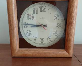 Wall clock in wood frame