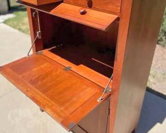 Ethan Allen high chest showing the drop front desk portion
