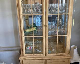 Lighted display cabinet, mirrored back, glass shelving