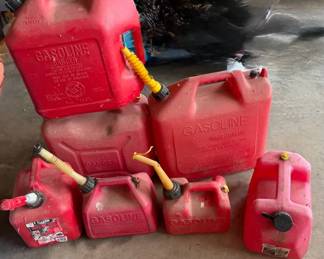 Seven Plastic Gas Cans