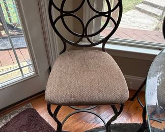 Wrought Iron Bistro Dining Set with Circular Back Chairs and Interlocking Ring Motifs
