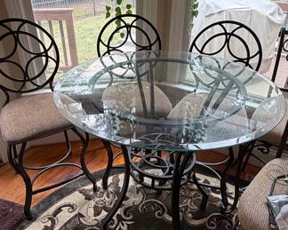 Wrought Iron Bistro Dining Set with Circular Back Chairs and Interlocking Ring Motifs