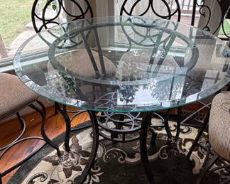 Wrought Iron Bistro Dining Set with Circular Back Chairs and Interlocking Ring Motifs