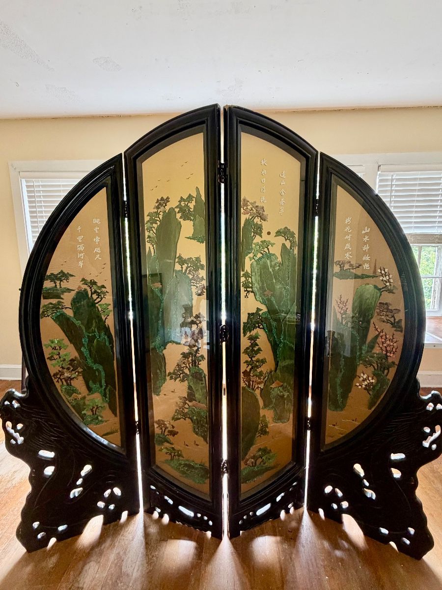 Stunning Asian-inspired folding room divider / decorative screen featuring carved dark wood frames, intricate landscape scenes, floral designs, birds, and traditional calligraphy. This is a large statement piece with beautiful detailing throughout and would make an incredible accent in a living room, dining room, entryway, or collection.  A truly eye-catching estate find — large, decorative, and full of character.