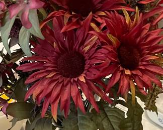 Vase with red sunflowers