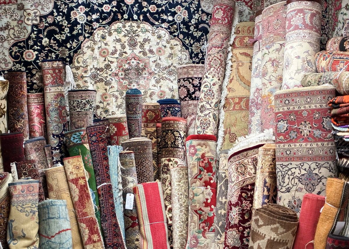 Warehouse view showcasing dozens of unique rugs and runners.
