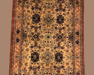 Blue and gold traditional rug featuring dense floral detailing and an elegant all-over pattern.