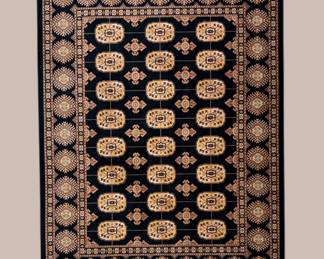 Deep teal and ivory rug featuring rows of repeating floral-style medallions framed by an ornate coordinating border.