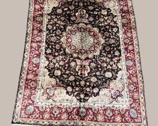 Deep burgundy and ivory rug with an ornate central medallion.