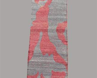Contemporary gray rug featuring a bold coral-red abstract pattern for a striking modern statement.