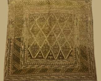 Olive and gold geometric rug featuring subtle repeating diamond motifs and a gently distressed appearance.