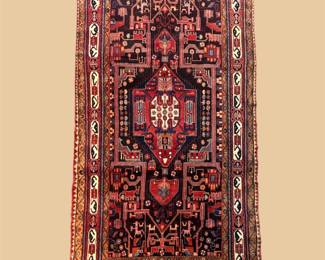 Deep red and black traditional runner featuring a bold central medallion and intricate geometric detailing.