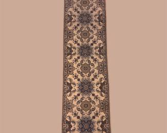 Narrow ivory and burgundy runner featuring repeating circular floral medallions and a detailed border.
