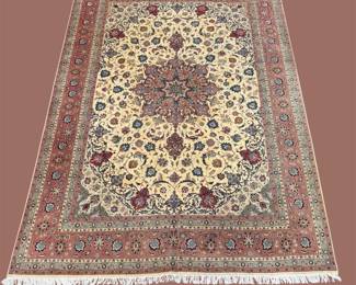 Ivory, burgundy, and muted green traditional rug featuring an intricate central medallion, floral detailing, and a decorative border.