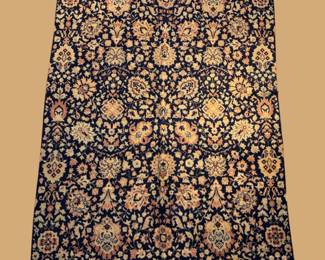 Dark navy and gold floral rug featuring a dense all-over botanical pattern with intricate repeating flowers.