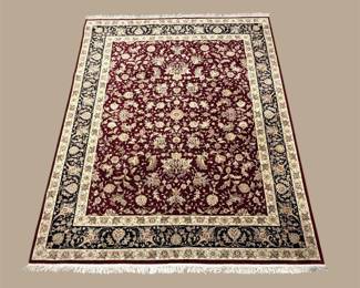 Rich burgundy traditional rug featuring a dense floral field framed by an ornate ivory, navy, and gold border.