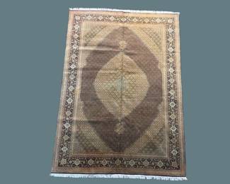 Dark brown and ivory traditional rug featuring a large diamond medallion and detailed surrounding border.