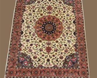 Ivory, rust, and gold traditional rug featuring a detailed circular medallion and intricate floral design.
