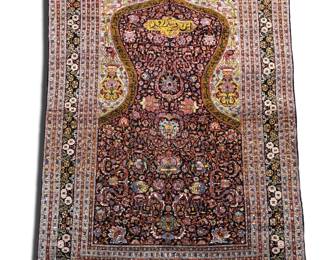 Warm brown and burgundy traditional rug featuring an ornate floral field with a richly detailed border.
