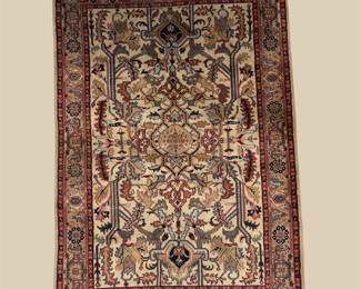 Warm gold, rust, burgundy, and ivory traditional rug featuring a dense floral and geometric pattern.