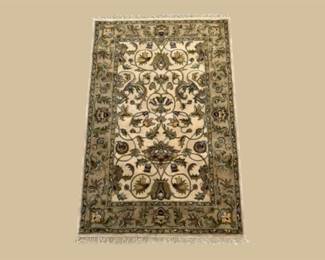 Bold multicolor geometric rug featuring diamond motifs in red, orange, gold, green, ivory, and blue.
