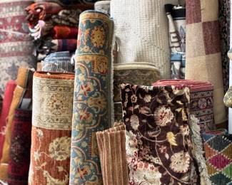 Rolled rug collection showcasing rich colors and intricate patterns.