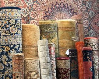 Warehouse rug collection with a wide variety of sizes, colors, and patterns.